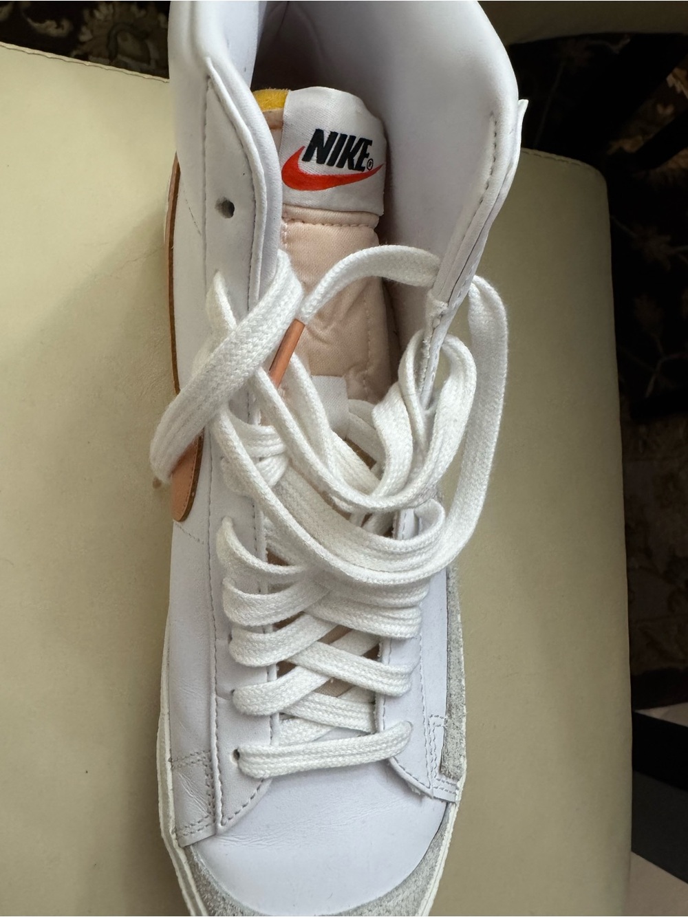 Nike White High-Top Sneakers with Orange Swoosh Accent